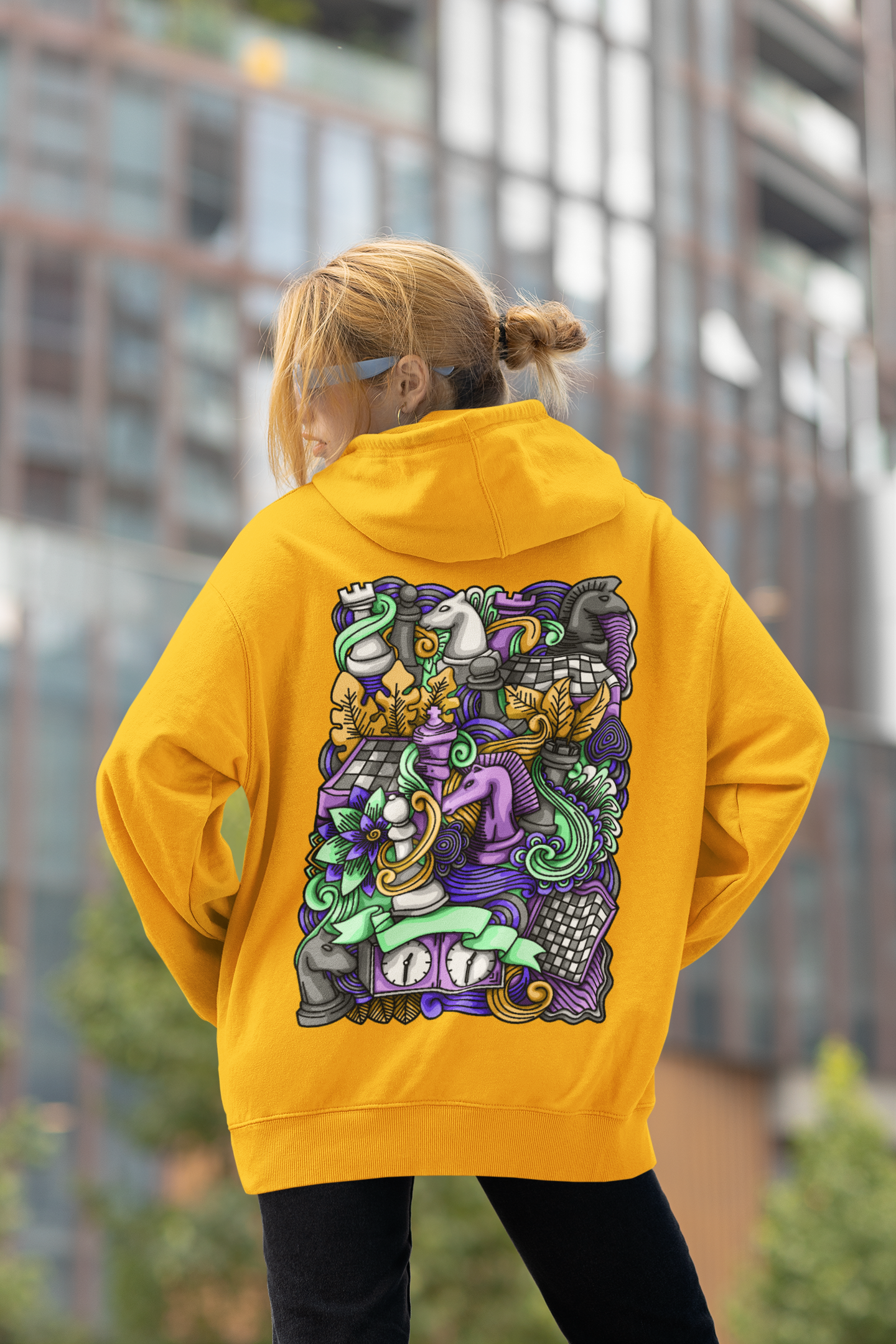 Gril wearing oversized with cool back printed mustard color hoodie ,